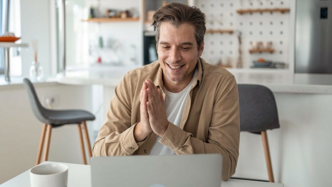 online visibility represented by a confident businessman working at his home-based business