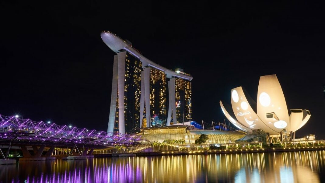 side hustle represented by a photo of the Singapore harbor after dark