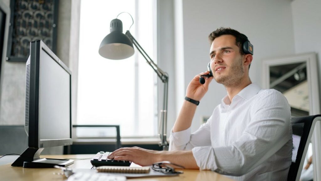 SPIN selling represented by a smiling man talking on the phone