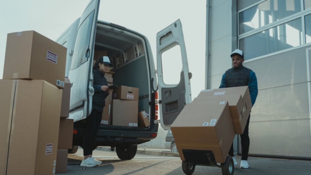 workers for a home delivery business loading freight for the day's deliveries